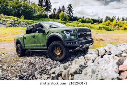 Seattle, WA, USA
July 19, 2021
Ford Raptor Roush With A Green Wrap Driving Over Rocks