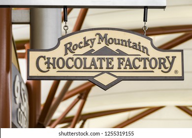 SEATTLE, WA, USA - JUNE 2018: Close Up View Of A Sign Outside The Rocky Mountain Chocolate Factory Store At The Premium Outlets Shopping Mall In Tulalip Near Seattle.