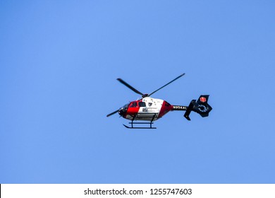 SEATTLE, WA, USA - JUNE 2018: Emergency Medical Eurocopter EC135 Helicopter Operated By Airlift Northwest Flying Over The City Of Seattle.