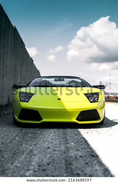 Seattle, WA,\
USA\
March 2, 2022\
Lamborghini Murcielago pictured head on with a\
shadow from a wall cast onto the\
car