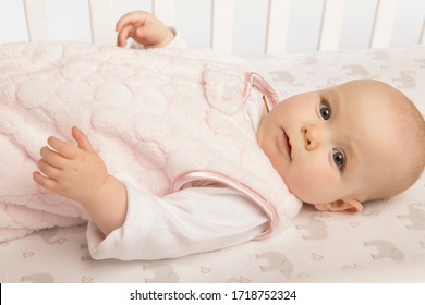 Seattle, WA / USA - May 2013: Safe Sleep Environment For Baby In Cozy Pink Puff Sleeping Sack By SwaddleDesigns