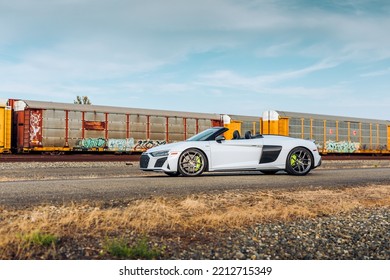 Seattle, WA, USA
October 10, 2022
White Audi R8 Spyder Parked With A Train In The Background