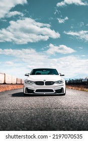 Seattle, WA, USA
September 1, 2022
BMW M4 Parked Next To A Rail Line With Train Cars