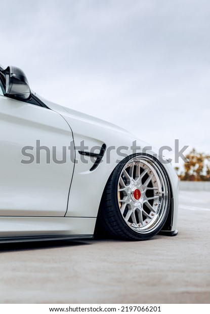 Seattle, WA,\
USA\
September 1, 2022\
BMW M4 parked showing the front wheel on\
the passenger side of the\
car