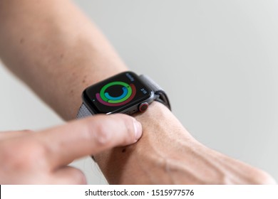 SEATTLE, WA / USA - September 27, 2019: Man Wearing Series 5 Apple Watch With Activity App Open