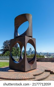 Seattle, WA, USA-July 2022; Close Up View Of Steel Sculpture Changing Form (Kinetic And Volumetric Space Frame) By Doris Totten Chase With Iconic Space Needle Seen Through Opening Of Artwork