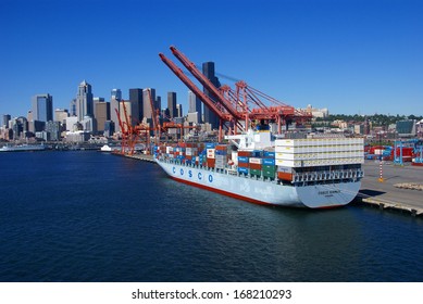 SEATTLE WASHINGTON 27 JUN 2008 -  Container ship and dockyard cranes, Seattle waterfront Puget Sound,  Pacific Northwest
