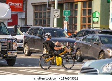 SEATTLE, WASHINGTON STATE, USA - JUNE 2018: Person Cycling To Work On An Unusual Bike On A Street In Downtown Seattle.