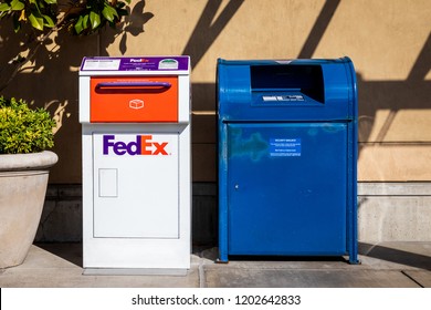 Seattle, Washington / USA - 10/04/2018 FedEx And USPS Mail Box Side By Side