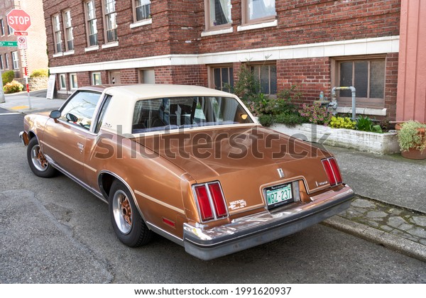 Seattle, Washington USA -\
April 06, 2021: cadillac brougham oldsmobile carriage retro car\
back view