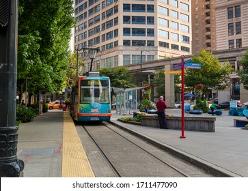 Seattle, Washington / USA - August 15th 2018: A Streetcar In Downtown Seattle Stopping At A Transit Stop To Pick Up Passengers