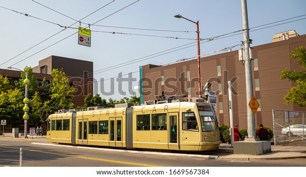 Seattle, Washington / USA - August 18th\
2018: Seattle Street Car stopped at Broadway & E Howell Street\
- Operated by Seattle Department of\
Transportation
