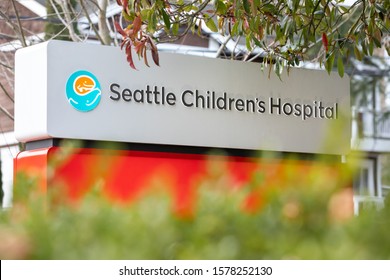 Seattle, Washington / USA - December 2 2019: Seattle Children's Hospital Sign Framed By Bushes