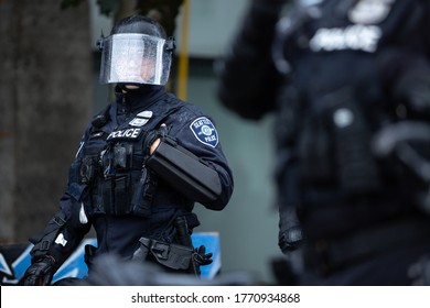 Seattle, Washington / USA - July 1 2020: Seattle Police In A Riot Helmet While Clearing The Capitol Hill Occupation Protest (CHOP)