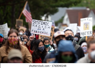 Seattle, Washington / USA - June 12 2020:  "Systemic Racism is a Pandemic" sign at the "March of Silence", during the COVID-19 outbreak