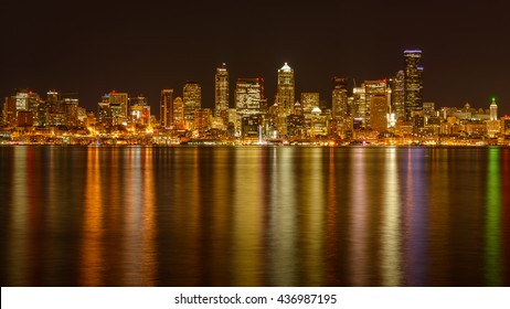 Seattle, Washington, USA - May 31, 2016: A Panoramic Night View Of Seattle Downtown, Looking From Alki Beach Crossing Elliott Bay. 