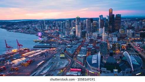 Seattle, Washington/USA - March 12, 2018: Aerial View From Port Of Seattle Shipping Yard Century Link Field Looking North Along Waterfront Spectacular Orange Sun Lighting Skyline