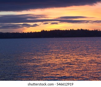Seattle's skyline from a lake in a winter sunset at Waverly Beach Park, Kirkland, Washington