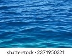 Seawater surface with small waves and gradient blue colors tone