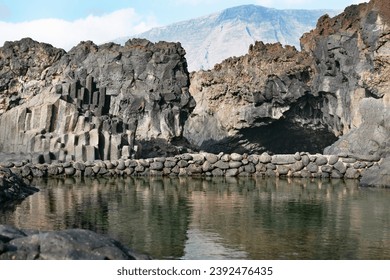 Seawaterpool Charco Azul, Blue Pool, a natural pool with clear water and basalt rock near Frontera, Tigaday, El Hierro Island, Canary Islands, Spain, Europe - Powered by Shutterstock