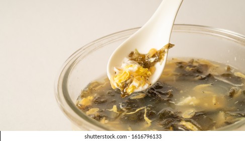 Seaweed Egg Flower Soup In Glass Bowl On Pure White Background