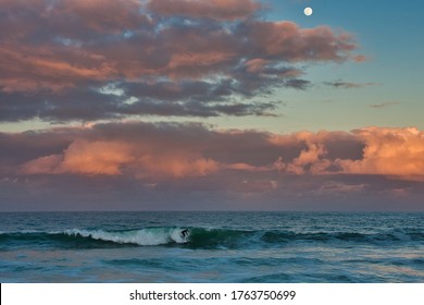 Sebastian Inlet Florida at sunset with full moon rising over the ocean
