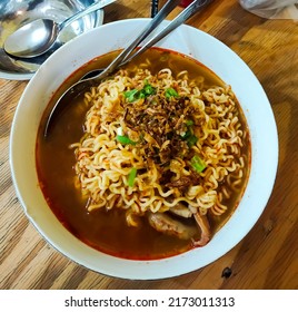 Seblak noodles with spicy sauce with bone filling and chicken feet are an archipelago snack that is very popular among many people. Bandung local food.