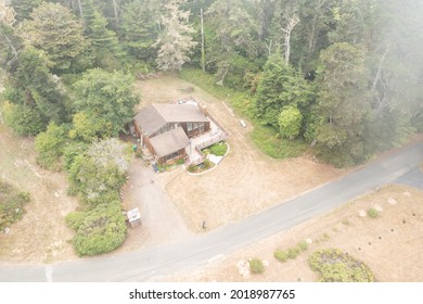 Secluded Coastal California Home Shot From A Drone Through The Fog