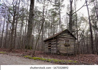 A secluded old cabin in the North Carolina woods in winter; landscape
