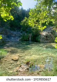 Secluded Swimming Hole with Turquoise-Tinged Clear Water