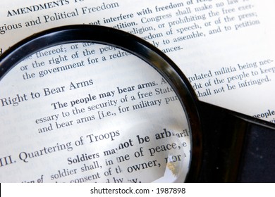 The Second Amendment To The Constitution Of The United States Is Shown Under A Magnifying Glass.