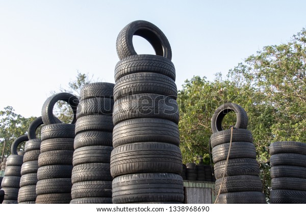 A second car Tyres on sale at a\
mechanic shop. A long shot of nicely arranged car\
Tyres.