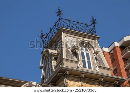 Second Empire Style Tower with a Decorative Railing on the on the Rooftop