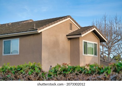 Second Floor Exterior Of A House With Light Brown Siding And Bricks Roof At Southern California