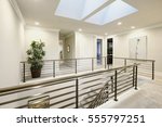 Second floor landing features skylight over the staircase with metal horizontal railings. Northwest, USA