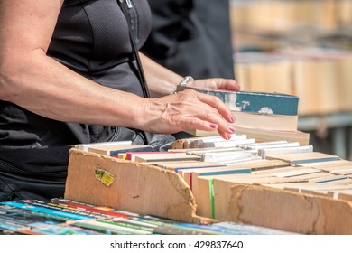 Second Hand Book Stall. Woman Buying Books