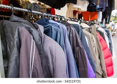 Second Hand Clothes   On A Hanger In Clothes Shop. Variety Of Clothes In The Market Thailand 