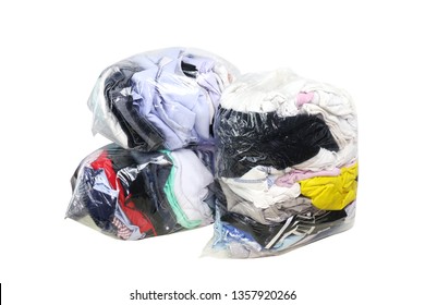 second hand clothes in the plastic bag isolated white background, clothes in bags plastic for donation, pile of dirty clothes, old cloth in plastic bag, clothes second hand for donate, clipping path