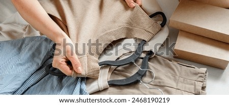 Second hand clothes, used wardrobe. Circular fashion, fast fashion, eco-friendly sustainable shopping, clothing recycling, top view,eco friendly, retail,no waste