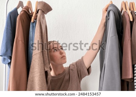 Second hand clothes, used wardrobe. Circular fashion, fast fashion, eco-friendly sustainable shopping, clothing recycling, top view,eco friendly, retail,no waste	