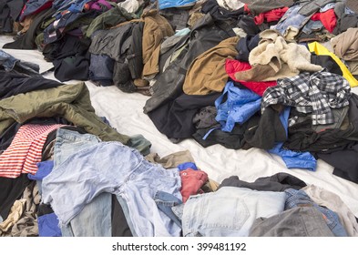 Second Hand Clothing Is Displayed On The Ground In Amsterdam, Netherlands.