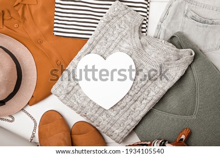 Second hand wardrobe idea. Circular fashion, eco friendly sustainable shopping, thrifting shop concept. Top view over woman outfit.