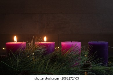 Second week of advent two pillar candles lit on advent wreath with copy space