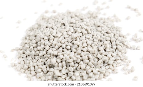 Secondary Granule Made Of Polypropylene, White Plastic Pellets Crumbles To The Table. Plastic Raw Materials In Granules For Industry. Polymer Resin. Raw Plastic Recycling Concept