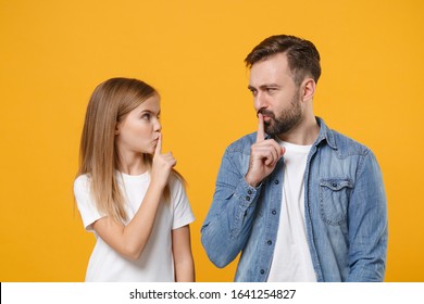 Secret Bearded Man Have Fun With Child Baby Girl. Father, Little Kid Daughter Isolated On Yellow Background. Love Family Day Parenthood Childhood. Say Hush Be Quiet With Finger On Lips Shhh Gesture