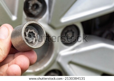 A secret bolt in a car wheel. Anti-theft protection, macro. Industry