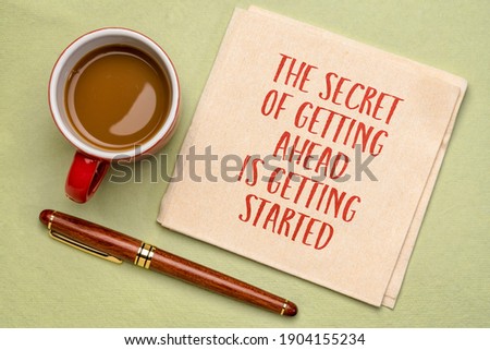 the secret of getting ahead is getting started - inspirational handwriting on a napkin with a cup of coffee, business, education and personal development concept