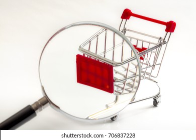 Secret Shopper Or Mystery Shopper Concept With A Magnifying Glass And A Shopping Basket Or Trolley Isolated On A White Background And Copy Space