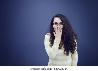 Secretary Or Business Woman With Suprised Look On Her Face Isolated Over Dark Background