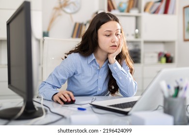 Secretary Girl Working In The Office Of A Large Company Prints Documentation On A Computer At The Workplace